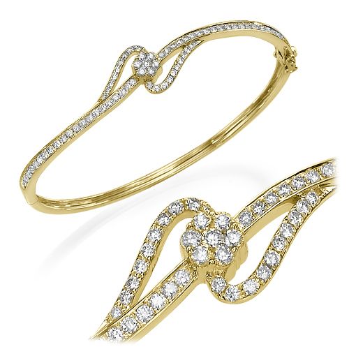 צמיד זהב צהוב עם יהלומים טבעיים בעיצוב מפותל ייחודי ובולט על היד